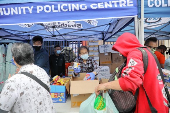 Recipient Melvin joined  other volunteers to distribute food hamper to low-income resident in DTES community.