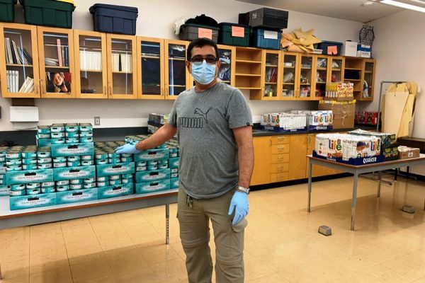 School Staff Storing Donation